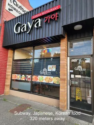 a pizza shop with a sign on the front of it at Near Skytrain and QUIET Private Bedroom Ensuite BathRM, Free Wifi & Coffee, Cozy in Burnaby