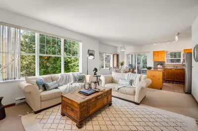 a living room with two couches and a coffee table at Desirable Blueberry Hill in Whistler