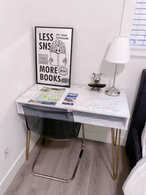 a desk in a bedroom with a lamp and a picture at Si & Daniel Home Near YVR Airport & Skytrain Separate Entry Free Parking in Richmond