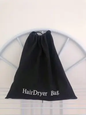 a black bag with the words hair drier bias on it at Si & Daniel Home Near YVR Airport & Skytrain Separate Entry Free Parking in Richmond