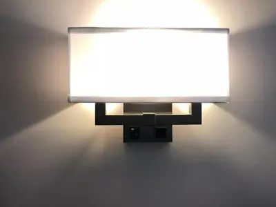 a light on a wall with a light on it at Chase Country Inn in Chase