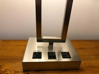 a stand for a electronic device on a wooden table at Chase Country Inn in Chase