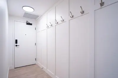 a row of wardrobes in a hallway with a door at Stoked 4Ever - Revelstoke Condo (+Hot Tub) in Revelstoke