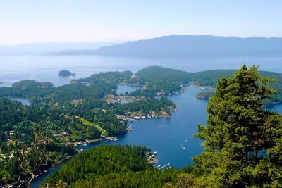 an aerial view of a lake in the woods at Madeira Park Oceanview Suites in Madeira Park