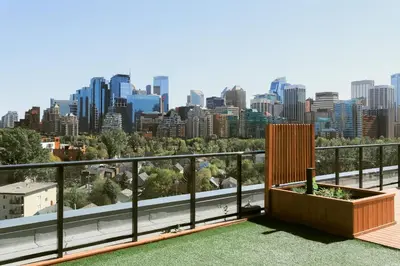 a balcony with a view of the city at Vibrant & Modern Loft-style Walkout Near LRT in Calgary