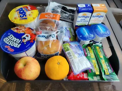 a drawer filled with breakfast foods and drinks at A Good Nite's Rest Bed and Breakfast in Banff