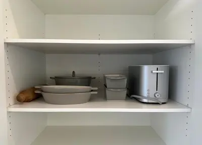 a shelf with various kitchen items on it at The Evergreen House in Red Deer