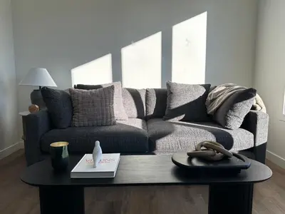 a living room with a couch and a coffee table at The Evergreen House in Red Deer