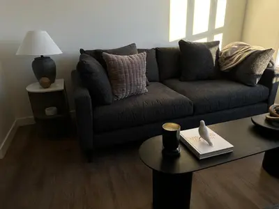 a living room with a couch and a coffee table at The Evergreen House in Red Deer