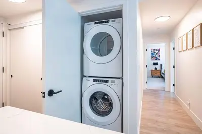 a laundry room with a washer and dryer at Rocky Ridge Getaway - Modern Getaway in Revelstoke in Revelstoke