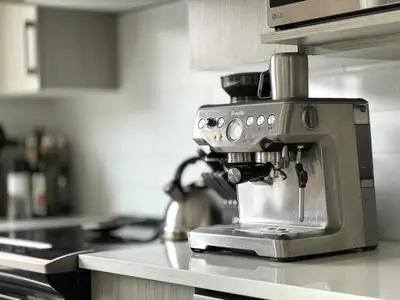 a coffee machine sitting on a counter in a kitchen at The Nest - Condo with Hot Tub & BBQ in Revelstoke