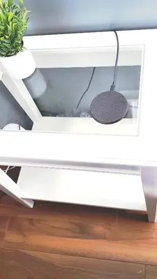 a white shelf with a plant and a pot at 12 Spacious Home W Ac, Crib, Garage, By Airport in Calgary