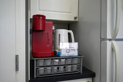 a kitchen drawer with a red blender on it at 12 Spacious Home W Ac, Crib, Garage, By Airport in Calgary