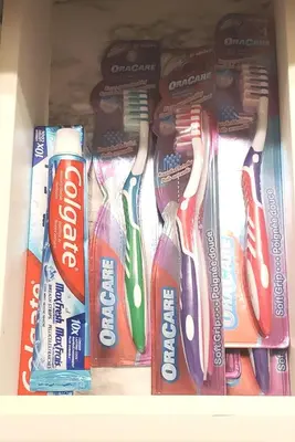 a drawer filled with toothbrushes and toothpaste at 12 Spacious Home W Ac, Crib, Garage, By Airport in Calgary