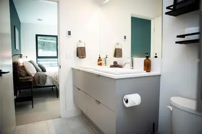 a bathroom with a sink and a mirror at Ski & Tee Retreat Bright Three Bedroom and Hot Tub in Revelstoke