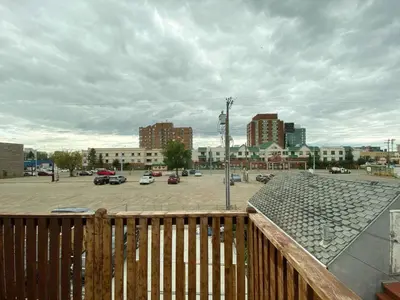 a view of a parking lot with buildings and cars at Calming 1bedroom Units With Balcony And City View in Edmonton