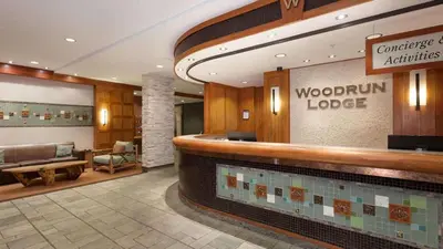 a lobby of a woodbury lodge with a pool at Woodrun Lodge 216 | Renovated Ski-In Ski-Out Condo w/ Free Parking, Pool, Hot Tub, & Gym in Whistler