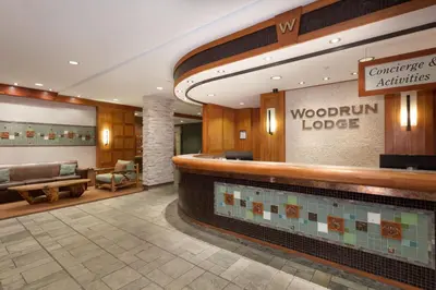 a lobby of a woodington lodge at Woodrun Lodge 107 | New Listing! Ski-in, Ski-Out, Heated Pool, Hot Tub & Parking in Whistler
