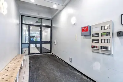 an empty room with a bench in a building at Industrial-Style Cityscape 1 Bedroom Loft in Edmonton