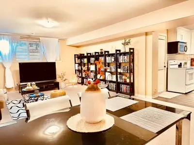 a living room with a television and a table at Scorpio House Langley ROOM B in Langley