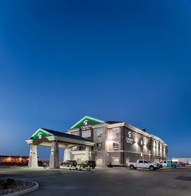 a gas station with a car parked in front of it at Canalta Lac La Biche in Lac La Biche