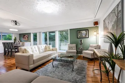 a living room with a couch and a table at NorthVAN nature living home in North Vancouver