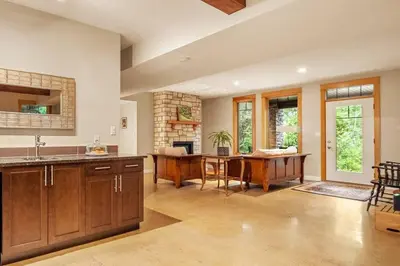 a kitchen with a table and a dining room at Escape to the Rockies but near Calgary Includes Free Parking and Banff Entry in Calgary