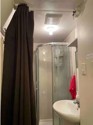 a bathroom with a shower and a sink at Friendly and cozy home with separate entrance No Pets Allowed in Burnaby