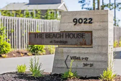 a sign that says the beach house at sanctuary at Coastal Haven at THE BEACH HOUSE in Campbell River