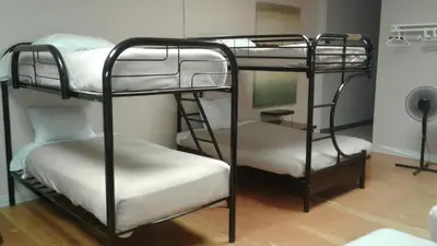 a couple of bunk beds in a room at Vernon Hostel in Vernon