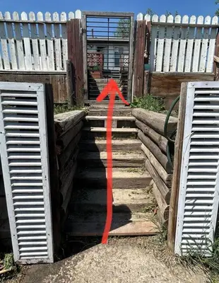 a red arrow on a set of stairs at Forth Street 2Bedroom Suite in Calgary