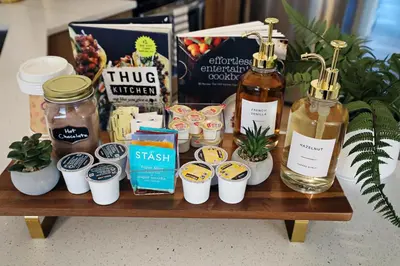 a wooden table with a bunch of products on it at Downtown 3 Queen Beds, AC, Double Garage, Disney in Edmonton