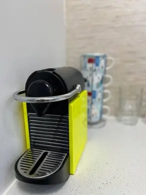 a black and yellow container sitting on a counter at 'Canyon Heights' Retreat (Grouse Mountain) in North Vancouver