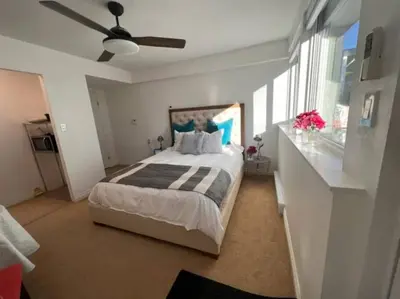 a bedroom with a bed and a ceiling fan at 'Canyon Heights' Retreat (Grouse Mountain) in North Vancouver