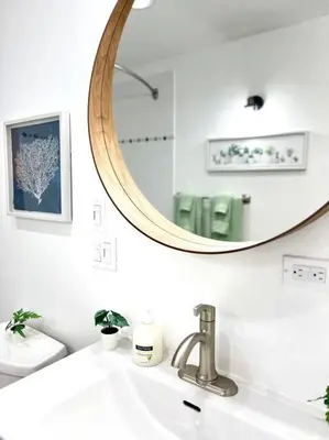 a bathroom with a sink and a mirror at 'Canyon Heights' Retreat (Grouse Mountain) in North Vancouver