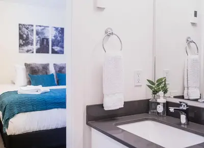 a bathroom with a sink and a bed at Peak Paradise by Revelstoke Vacations in Revelstoke
