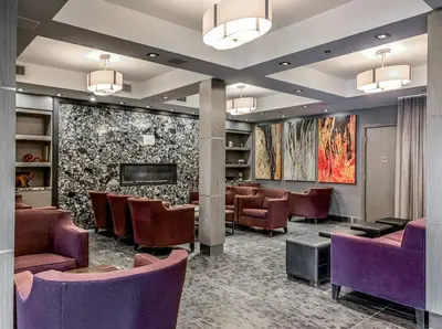 a waiting room at a hospital with purple chairs at G222 Family Fun- MTN View Stay, Water slide, Pool, Hot Tub, Free Parking in Canmore
