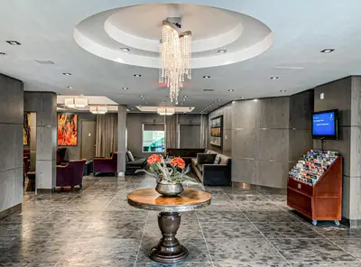 a lobby with a vase of flowers on a table at G222 Family Fun- MTN View Stay, Water slide, Pool, Hot Tub, Free Parking in Canmore