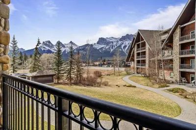 a balcony with a view of the mountains at G222 Family Fun- MTN View Stay, Water slide, Pool, Hot Tub, Free Parking in Canmore