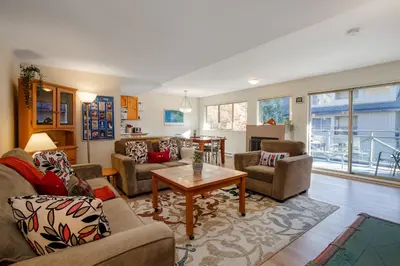 a living room with couches and a table at 2BR in Valhalla, Whistler Village, Complex Hot Tub, Gas Fireplace, Parking, Gondola Shuttle in Whistler