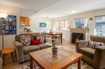 a living room with two couches and a table at 2BR in Valhalla, Whistler Village, Complex Hot Tub, Gas Fireplace, Parking, Gondola Shuttle in Whistler