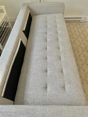 a bed in a room with at Homelike & cozy suite in Langley