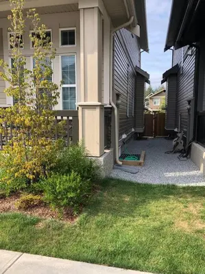 a house with a walkway next to a house at Homelike & cozy suite in Langley