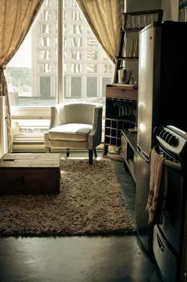 a living room with a chair and a window at 2 Full Beds, Free Parking Underground Heated, Rogers Place, 1 Bedroom Condo Downtown Central in Edmonton