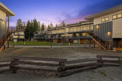 a group of buildings in a park at dusk at Beachfront Luxury Suite #15 at THE BEACH HOUSE in Campbell River