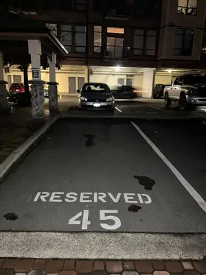 a car parked in a parking lot with the word reserved at Laid Back In Langford in Langford