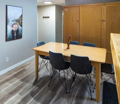 a conference room with a wooden table and chairs at 2 Bedroom and Wall Bed Mountain Getaway Ski In Ski Out Condo with Hot Pools Sleeps 8 in Panorama