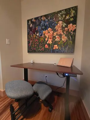a desk with two chairs and a painting on the wall at Five Star-Amazing views and Hot Tub in Crescent Valley