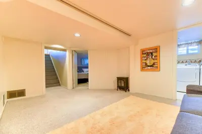 a living room with a couch and a table at First Place in Strathmore