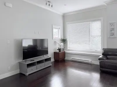 a living room with a flat screen tv and a couch at Spacious Home in Richmond in Richmond